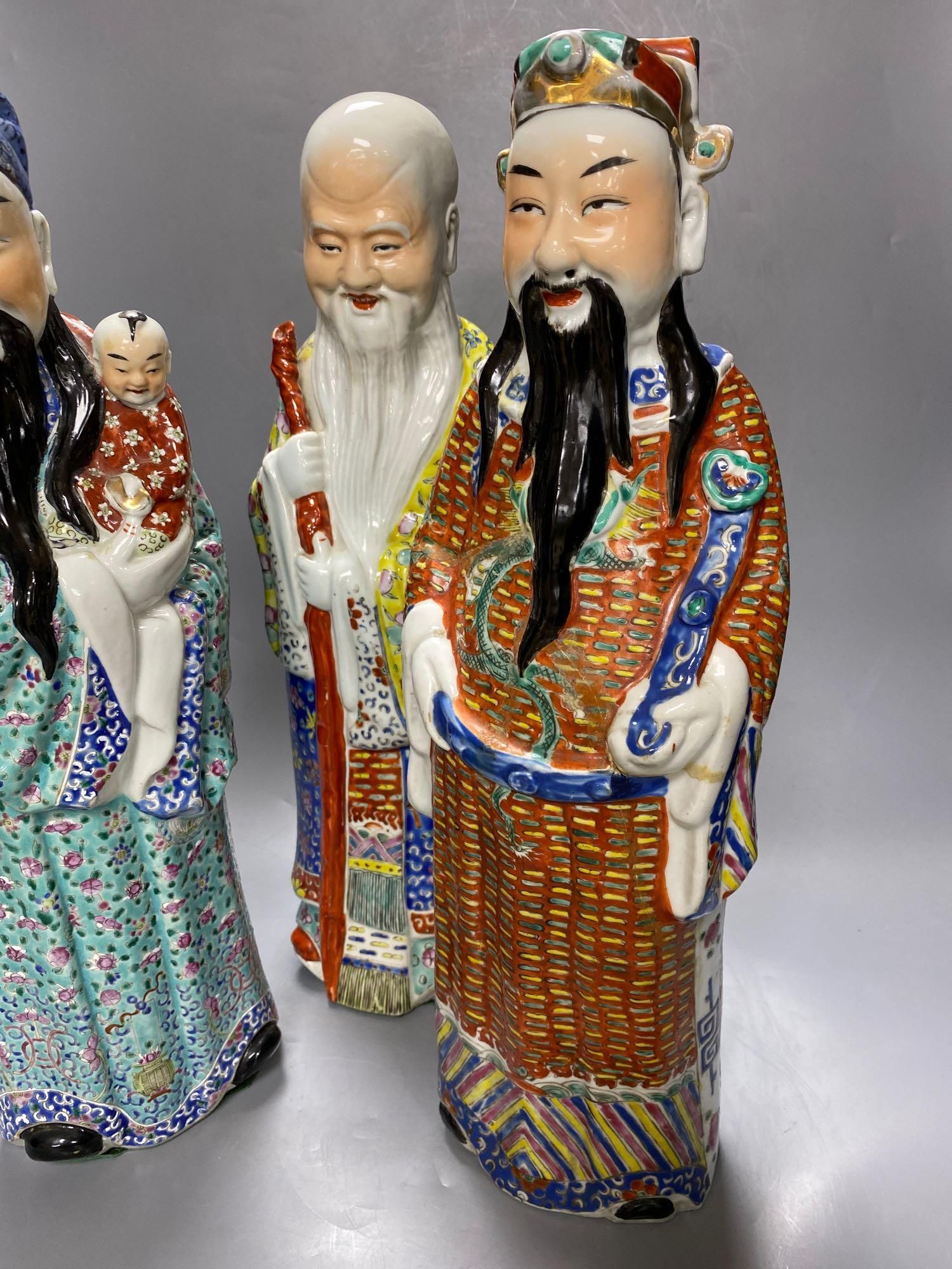 A group of three Chinese porcelain immortals, 47cm